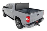 Hard Tri-Fold Flip Up Bed Cover | 5'7" Bed | Toyota Tundra 2WD/4WD (07-21) view 5