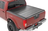 Hard Low Profile Bed Cover | 5' Bed | Cargo Mgmt | Nissan Frontier (05-21) view 1