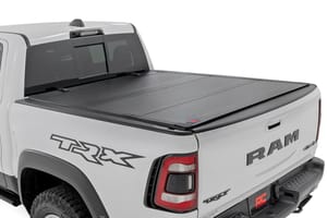 Tonneau Covers - Hard Tri-Fold Flip Up Fold Bed Cover | 5'7" Bed | Ram 1500 (19-26)/1500 TRX (21-24)