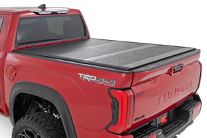 Tonneau Covers - Hard Low Profile Bed Cover | 5'7" Bed | Cargo Mgmt | Toyota Tundra (22-26)